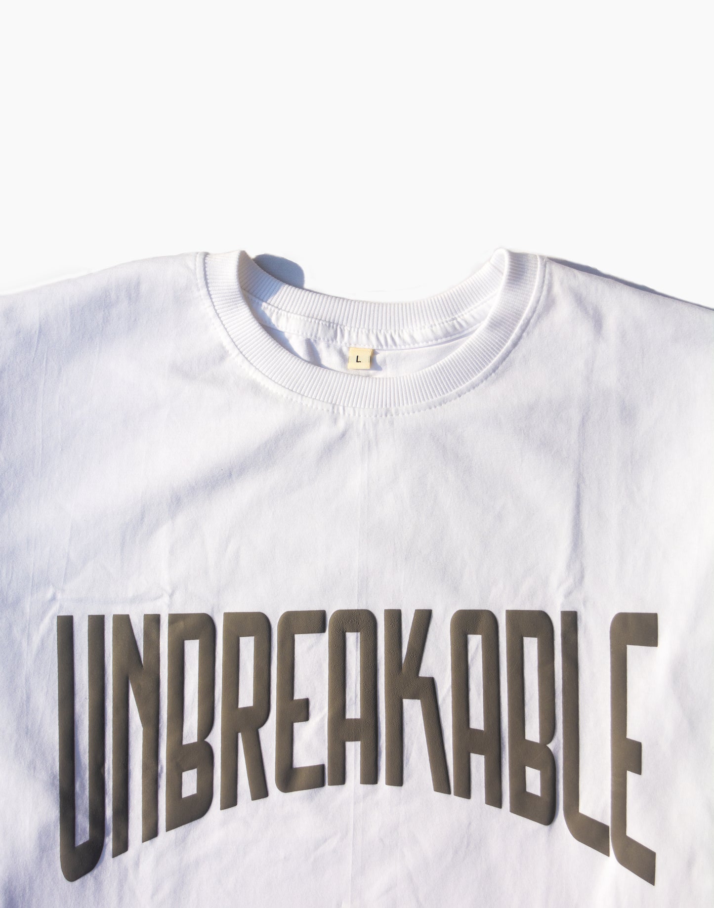 UNBREAKABLE TYPO PUFF PRINT OVERSIZED TSHIRT